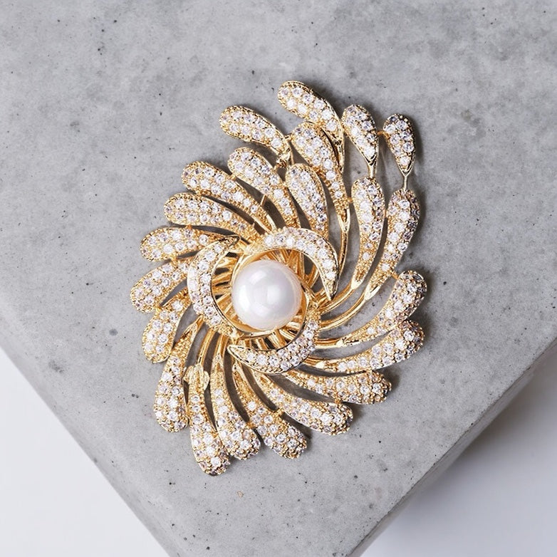 Gold diamante swirl & faux pearl brooch